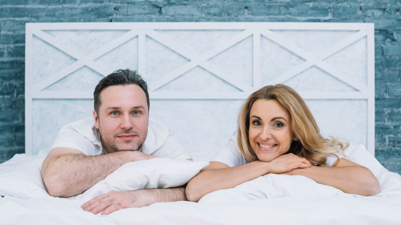Happy couple in bed